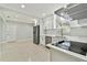 Modern kitchen features stainless steel appliances, a white countertop, and ample cooking space at 1231 27Th S Ave, St Petersburg, FL 33705