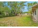 Expansive backyard featuring mature trees and lush greenery offering ample space for outdoor activities at 13102 Wagner Dr, Hudson, FL 34667