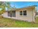 Exterior shot of home displaying a screened in patio and updated windows allowing for natural light at 13102 Wagner Dr, Hudson, FL 34667