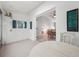 Bright Florida room with painted block walls, neutral colors, and access to a dining area at 13102 Wagner Dr, Hudson, FL 34667