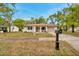 Adorable single-Gathering home with a cozy front porch and attached garage, perfect for first-time buyers at 13102 Wagner Dr, Hudson, FL 34667