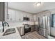 Updated kitchen featuring stainless steel appliances and white countertops at 13102 Wagner Dr, Hudson, FL 34667