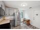 Eat-in kitchen with stainless steel appliances and shaker cabinets at 13102 Wagner Dr, Hudson, FL 34667