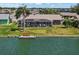 Waterfront home with a screened lanai and a private dock, ideal for enjoying the tranquil water views at 1804 Bunker Hill Dr, Sun City Center, FL 33573