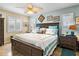 Stylish bedroom with coastal decor, white shutters, and a plush king-size bed at 1804 Bunker Hill Dr, Sun City Center, FL 33573