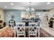 Dining room view to kitchen bar stool seating area, and lots of natural light at 1804 Bunker Hill Dr, Sun City Center, FL 33573