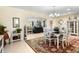 Open dining area with archway view to living room with lots of natural light at 1804 Bunker Hill Dr, Sun City Center, FL 33573