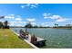 Scenic waterfront view from the dock with a bench, plants, and peaceful surroundings at 1804 Bunker Hill Dr, Sun City Center, FL 33573
