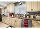 Kitchen features custom cabinets, granite countertops, stainless steel appliances, and a tile backsplash at 1804 Bunker Hill Dr, Sun City Center, FL 33573