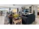 Cozy living room featuring comfortable seating, built-in shelving, and tranquil water views at 1804 Bunker Hill Dr, Sun City Center, FL 33573