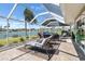 Relaxing outdoor patio with comfortable seating, stunning water views, and plenty of space for entertaining at 1804 Bunker Hill Dr, Sun City Center, FL 33573