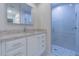 Updated bathroom featuring a modern vanity with a granite countertop and a sleek glass-enclosed shower at 18836 Summersong Dr, Hudson, FL 34667