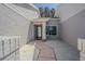 Inviting front entrance with a decorative walkway and stylish front door, and classic color palette at 18836 Summersong Dr, Hudson, FL 34667