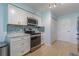 Modern kitchen featuring stainless steel appliances, beautiful backsplash and ample counter space for food prep at 18836 Summersong Dr, Hudson, FL 34667