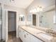 Bathroom with double sinks, granite countertop, and walk-in shower at 2412 Arborwood Dr, Valrico, FL 33596