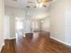 Inviting living room with hardwood floors offering open access to other areas of the home at 2412 Arborwood Dr, Valrico, FL 33596