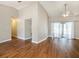 Spacious living area with hardwood floors and vaulted ceilings, offering ample room for entertaining guests at 2412 Arborwood Dr, Valrico, FL 33596