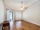 Bright living room featuring wood floors, vaulted ceiling with fan, and sliding glass door to the outside at 2412 Arborwood Dr, Valrico, FL 33596