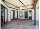Covered patio features brick floor and ceiling fan at 2412 Arborwood Dr, Valrico, FL 33596