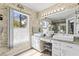 Bright bathroom with double sink vanity, decorative wall, and a window allowing natural light at 2759 Conch Hollow Dr, Brandon, FL 33511