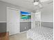 Comfortable bedroom with a ceiling fan, TV, and closet at 2759 Conch Hollow Dr, Brandon, FL 33511