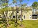 Two-story townhome surrounded by mature trees and landscaping, offering a tranquil setting at 2759 Conch Hollow Dr, Brandon, FL 33511