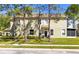 Two-story townhome surrounded by mature trees, and manicured landscaping, offering a tranquil setting at 2759 Conch Hollow Dr, Brandon, FL 33511
