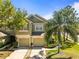 Inviting two-story home with a two-car garage and a beautifully landscaped front yard at 2759 Conch Hollow Dr, Brandon, FL 33511