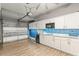 Garage features updated kitchen with granite counters, and a blue tile backsplash at 2759 Conch Hollow Dr, Brandon, FL 33511