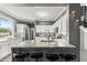 Spacious kitchen island with bar seating, granite countertops, and a view of the kitchen layout at 2759 Conch Hollow Dr, Brandon, FL 33511