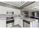 Open-concept kitchen featuring stainless steel appliances, stone counter tops, and an adjacent dining area at 2759 Conch Hollow Dr, Brandon, FL 33511