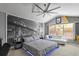 A spacious main bedroom showcases unique decor, ample natural light, and comfortable furnishing at 2759 Conch Hollow Dr, Brandon, FL 33511