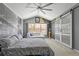 A spacious main bedroom showcases unique decor, ample natural light, and closet with glass doors at 2759 Conch Hollow Dr, Brandon, FL 33511