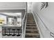 View of the staircase highlighting the unique stone-accented steps and decorative iron railing at 2759 Conch Hollow Dr, Brandon, FL 33511