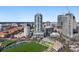 Aerial view of a modern high-rise condo in a vibrant city setting near a stadium at 301 1St S St # 3207, St Petersburg, FL 33701