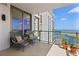 Condo balcony with waterfront views, outdoor seating, and potted plants at 301 1St S St # 3207, St Petersburg, FL 33701