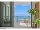 Condo balcony with stunning waterfront views, outdoor seating, and potted plants at 301 1St S St # 3207, St Petersburg, FL 33701