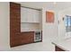 Modern bar area featuring custom cabinets and a built-in wine refrigerator at 301 1St S St # 3207, St Petersburg, FL 33701