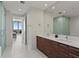 Bright bathroom featuring double vanity with modern fixtures and glass walk-in shower at 301 1St S St # 3207, St Petersburg, FL 33701