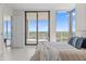 Bright bedroom featuring floor-to-ceiling windows and a balcony with scenic city views at 301 1St S St # 3207, St Petersburg, FL 33701