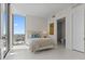 Sunlit bedroom with a large window and city views, adjacent to a modern bathroom at 301 1St S St # 3207, St Petersburg, FL 33701