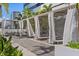 Modern cabanas offer a relaxing retreat with cushioned seating and privacy curtains on a wooden floor at 301 1St S St # 3207, St Petersburg, FL 33701