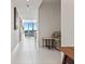 Bright hallway with white tile floors leading to an open living area with beautiful views at 301 1St S St # 3207, St Petersburg, FL 33701