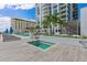 Rooftop hot tub with city views and palm trees, adjacent to a serene pool area at 301 1St S St # 3207, St Petersburg, FL 33701