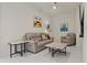 Cozy living room featuring a comfortable seating area, ceiling fan, and stylish decor at 301 1St S St # 3207, St Petersburg, FL 33701