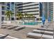 Rooftop aquamarine swimming pool with sun shelf, chaise lounges and umbrellas at a luxury condominium complex at 301 1St S St # 3207, St Petersburg, FL 33701