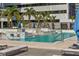 Rooftop swimming pool with sun shelf, chaise lounges and umbrellas at a luxury condominium complex at 301 1St S St # 3207, St Petersburg, FL 33701