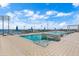 Rooftop pool with ocean views, blue umbrellas and plenty of lounge chairs at 301 1St S St # 3207, St Petersburg, FL 33701