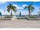 Stunning rooftop pool area with palm trees and ocean views, perfect for relaxation at 301 1St S St # 3207, St Petersburg, FL 33701
