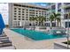 Bright pool scene with sun shelves, palm trees and city backdrop offer a luxurious escape at 301 1St S St # 3207, St Petersburg, FL 33701